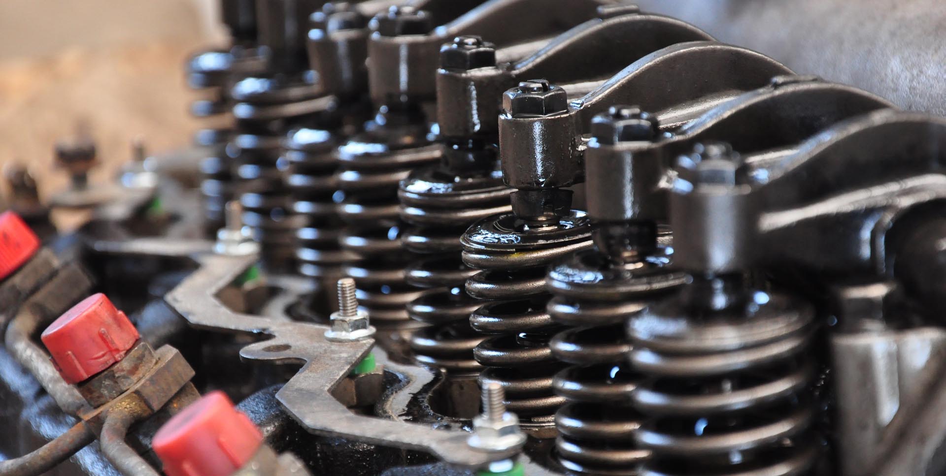 Mechanic at work on car engine